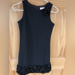 Black semi-formal dress with ruffle detail.